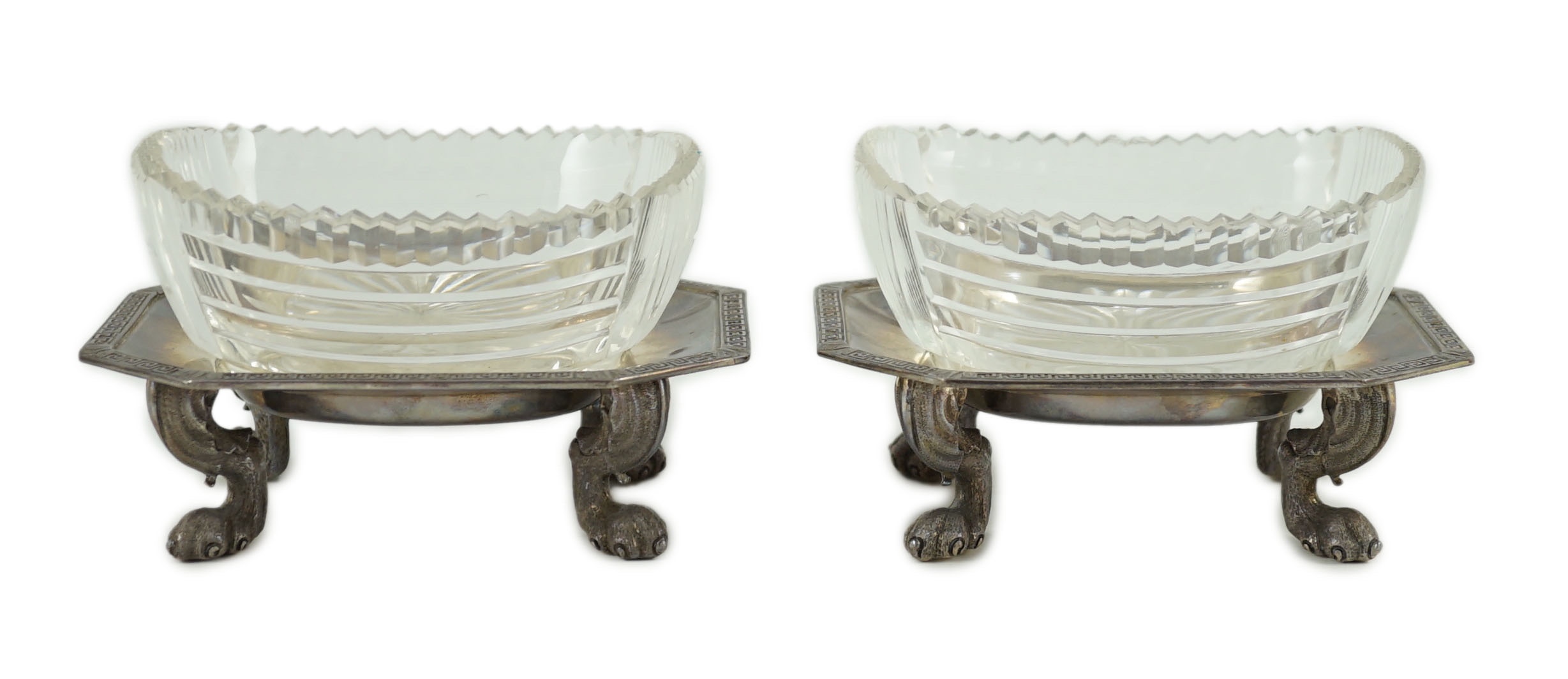 A pair of George V silver salt cellars, with cut glass liners
